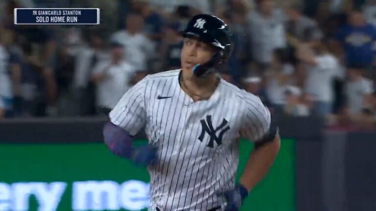 Yankees' Giancarlo Stanton crushes a solo home run against the Rockies