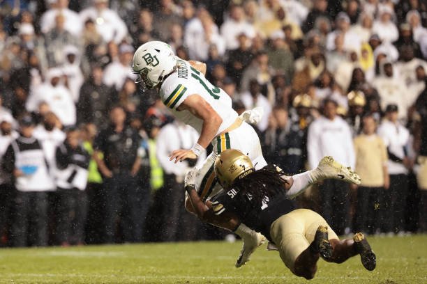 boulder colorado sawyer robertson of the baylor bears is tackled by camron silmon craig of Jpysr9