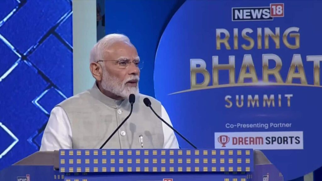 PM Modi Rising Bharat: 'देरी विकास की दुश्मन है' राइजिंग भारत समिट में बोले PM मोदी